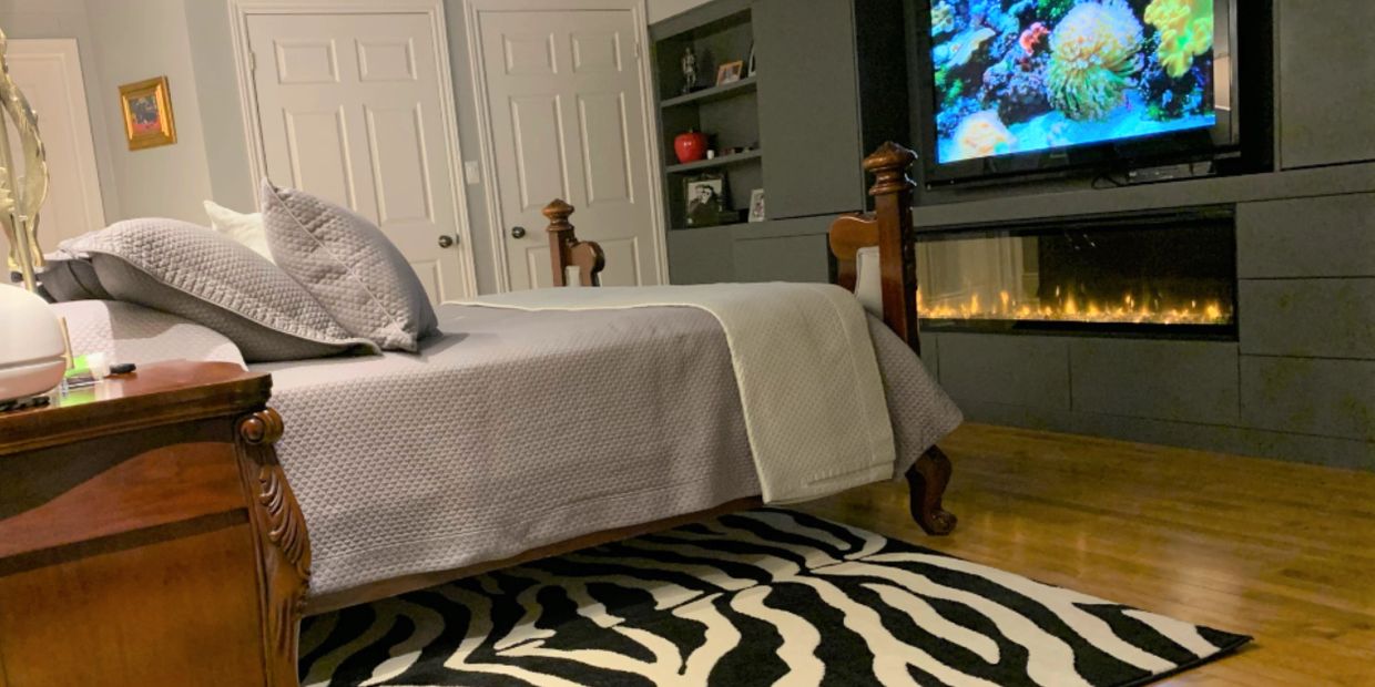 Birdseye Maple floor and fireplace in bedroom