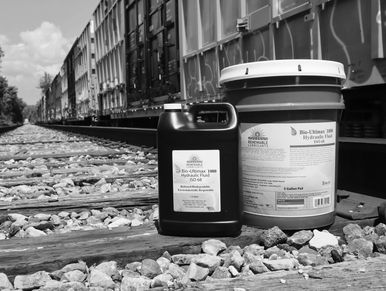 Gallon jug and Pail on railroad
