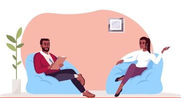 Two people having a conversation while sitting on blue bean bags.
