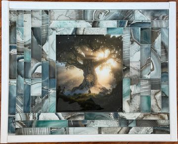 Framed artwork of a glowing tree at sunset.