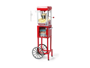 Vintage red popcorn machine with storage and wheels.