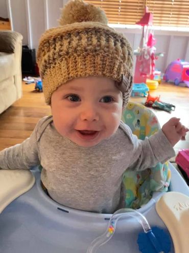 This little one loves his new beanie!