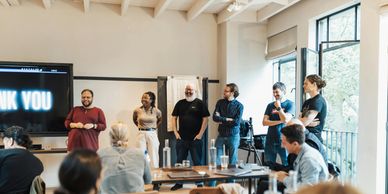 Group presentation in a modern office space.