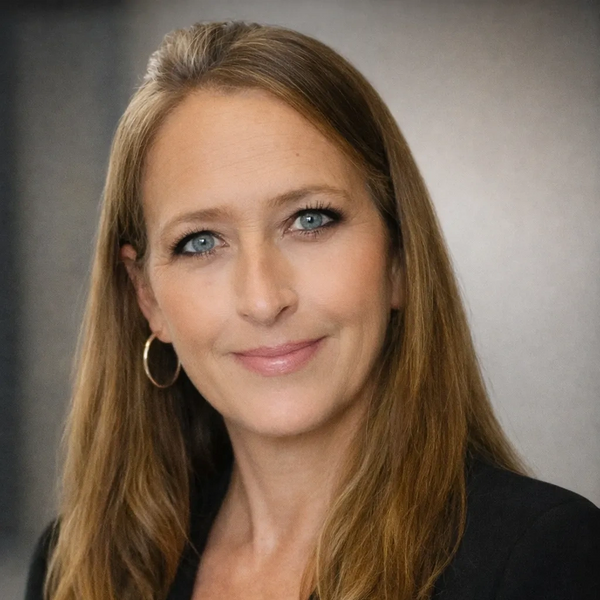 Picture of  the authorized representative. Long blond hair with hoop earrings 