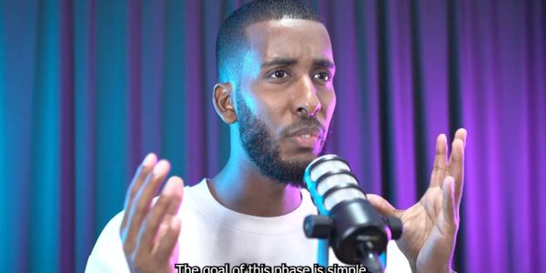 Man speaking passionately into a microphone.