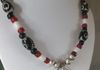 EE-249 Happy Naja: Vintage Navajo Naja Pendant strung with old African Red White Heart Trade Beads and old Black Africa Padre Trade Beads, accented with old Agate Beads from Nepal. $85