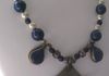 EE-327 Blue and Silver: Metal Pendant from Nepal and two Lapis Pendants strung with Lapis Beads, highlights with Metal Beads from Ethiopia and Glass Blue Beads. $85