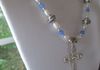 EE-375 Etched Cross: Vintage Bell Trading Post Sterling Silver Cross strung with Fresh Water Pearls and Vintage Blue Glass Beads, accented with eight Tibetan Silver Beads and two Native American Silver Bench Beads. $85
