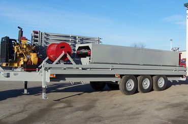 Flatbed trailer with heavy equipment