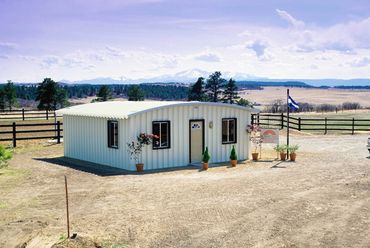 Angled view of a white metal cabin
