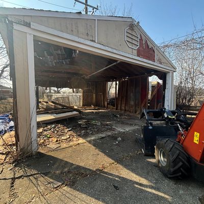 Garage Demolition by Metro Load Runners Junk Removal. Photo by Syid Powell in Oak Park, MI. 