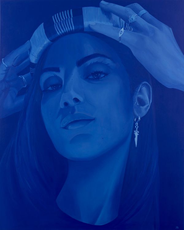 Blue-toned portrait of a woman adjusting a striped headband with rings and dagger earring.