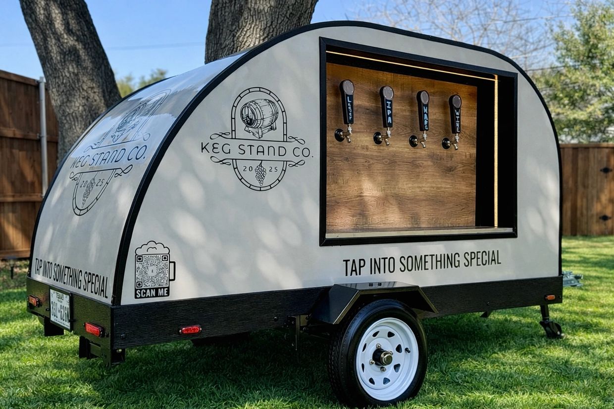 Teardrop trailer with 4 beer draft taps on the side. There is also a logo for Keg Stand Co.