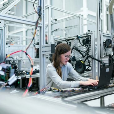 Engineer Reviewing Data for Testing of Robotics Project