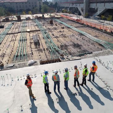 Construction Project Manager, Estimator and Surveyor overseeing commercial building project