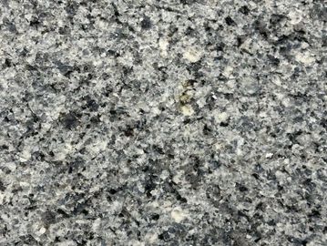 Close-up of gray granite stone surface with black and white speckles.
