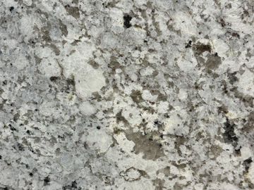 Close-up of a textured granite surface with white, gray, and black speckles.