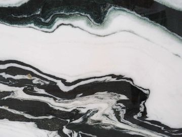 Close-up of black and white marble texture with flowing patterns.