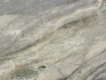 Close-up of a textured gray marble surface with natural veining.