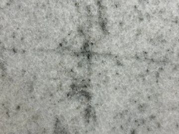 Close-up of gray marble with black veins.