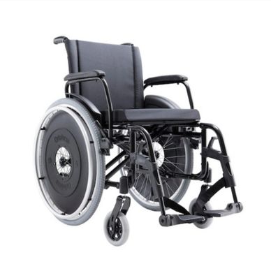 Modern black wheelchair with cushioned seat and large rear wheels.