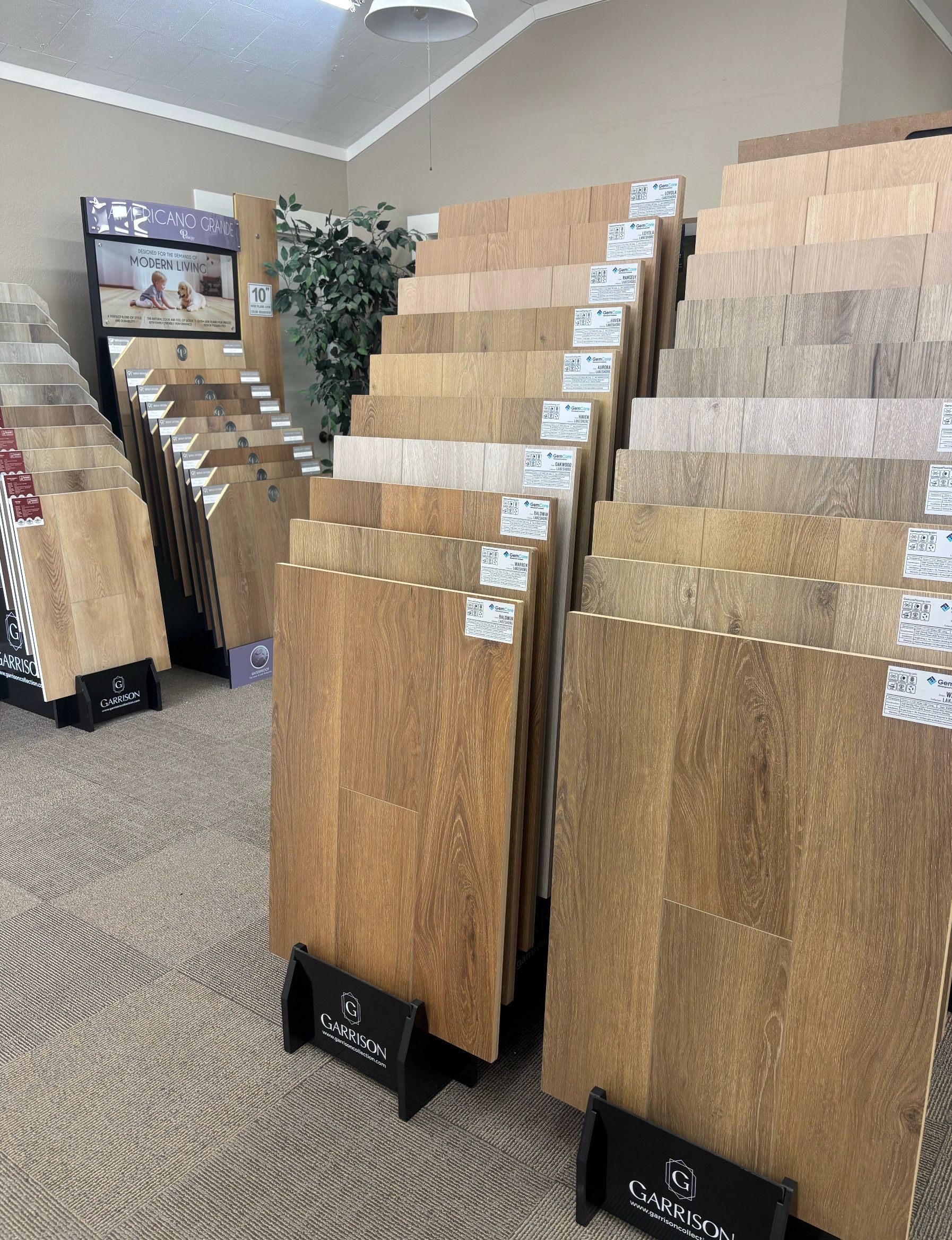 Wood flooring samples displayed in a showroom for customers to choose from.