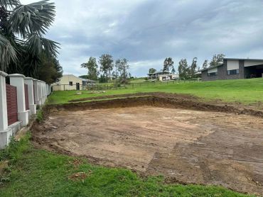 Cleared plot of land in a residential area.