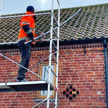 Moss on roof removal using a soft clean.