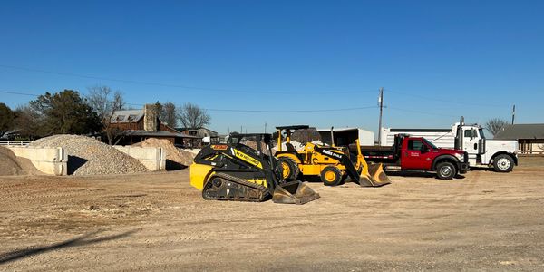Efficient trucks and tractors for hauling premium landscaping materials.