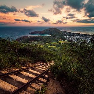 Picture of Koko Head stairs at sunset. Stairs are made of an old railroad and go down the mountain w