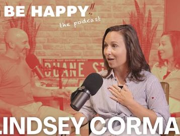Podcast hosts engaged in a lively conversation on 'Be Happy' show.