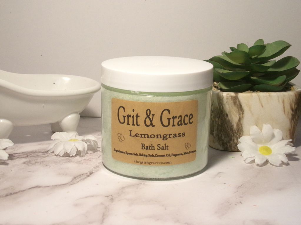 Grit &amp; Grace Lemongrass Bath Salt jar with decorative flowers and a succulent.