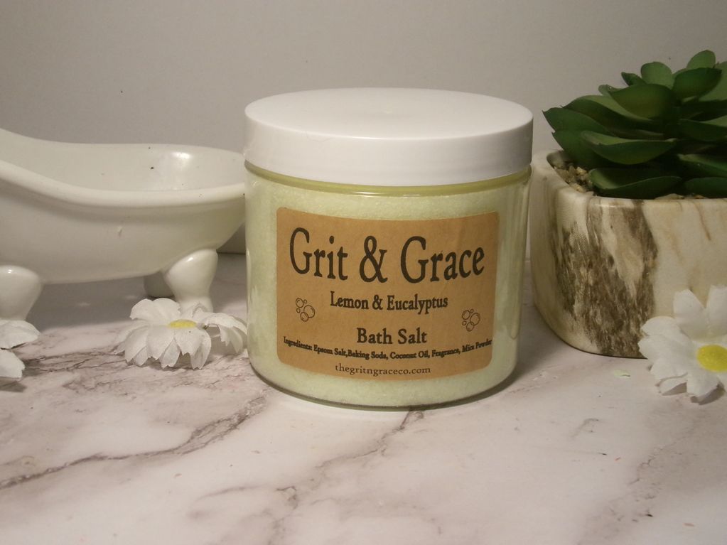 Jar of Grit &amp; Grace lemon and eucalyptus bath salt on a marble surface.