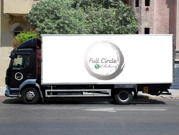 Delivery truck with Full circle kitchens logo 