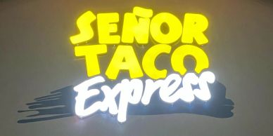 Señor Taco Express restaurant sign in yellow and white.