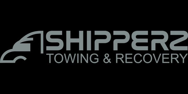Logo of Shippers Towing & Recovery with a truck icon.