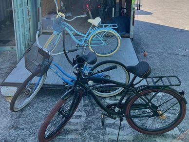 2 beach cruiser bikes on the sand at tampa bay beach. www.whatsuppaddlesports.com