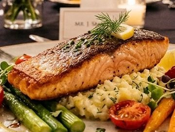 Grilled salmon with vegetables and mashed potatoes.