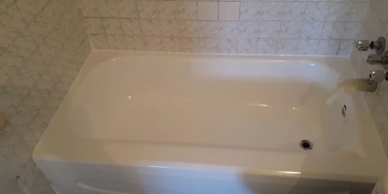 After photo of original blue tub being refinished to white.