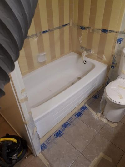 Bathtub and surrounding areas prepped to be refinished.