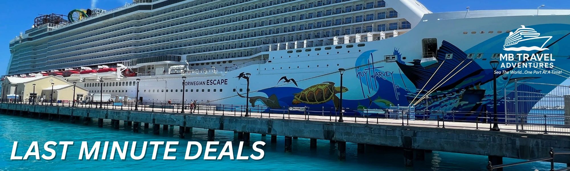 Norwegian Escape cruise ship docked under clear blue skies.