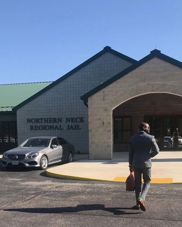 Man in suit walking into Northern Neck Regional Jail.