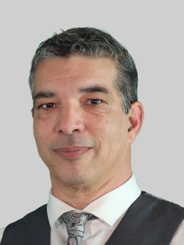 Portrait of a middle-aged man in formal attire.