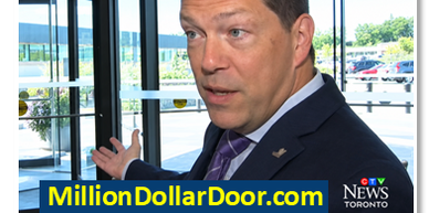 Chris Leahy points to the million dollar doorat Durham Regional Headquarters visit MillionDollarDoor