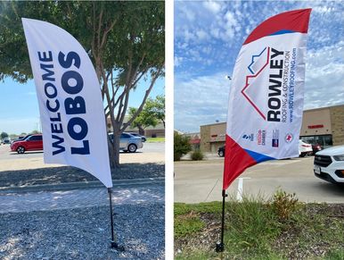 Two custom feather flags displayed outdoors: a Welcome Lobos flag for Little Elm ISD and a branded f