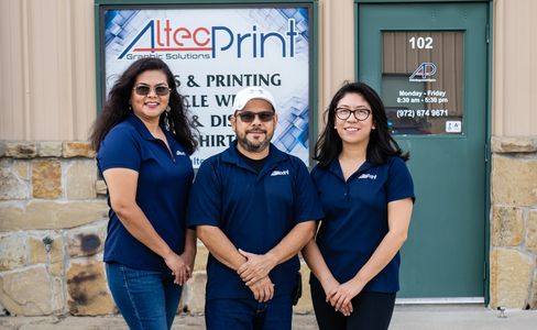 3 people standing infant of a business 