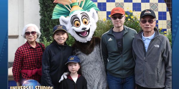 Dr. Liaw with her family and parents at Universal Studios with King Julian.