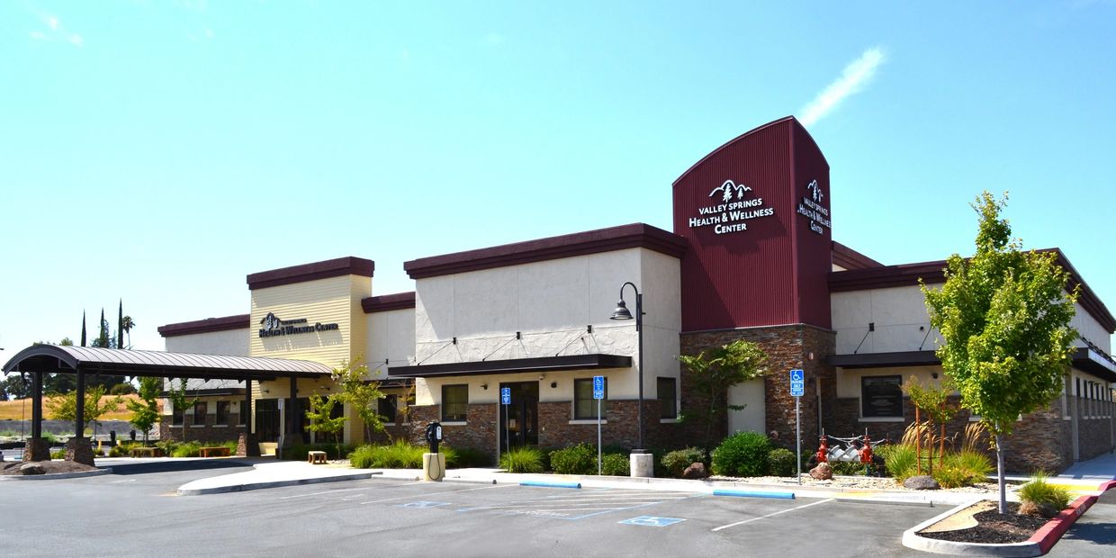 Modern Valley Springs Health & Wellness Center building with parking and landscaping.
