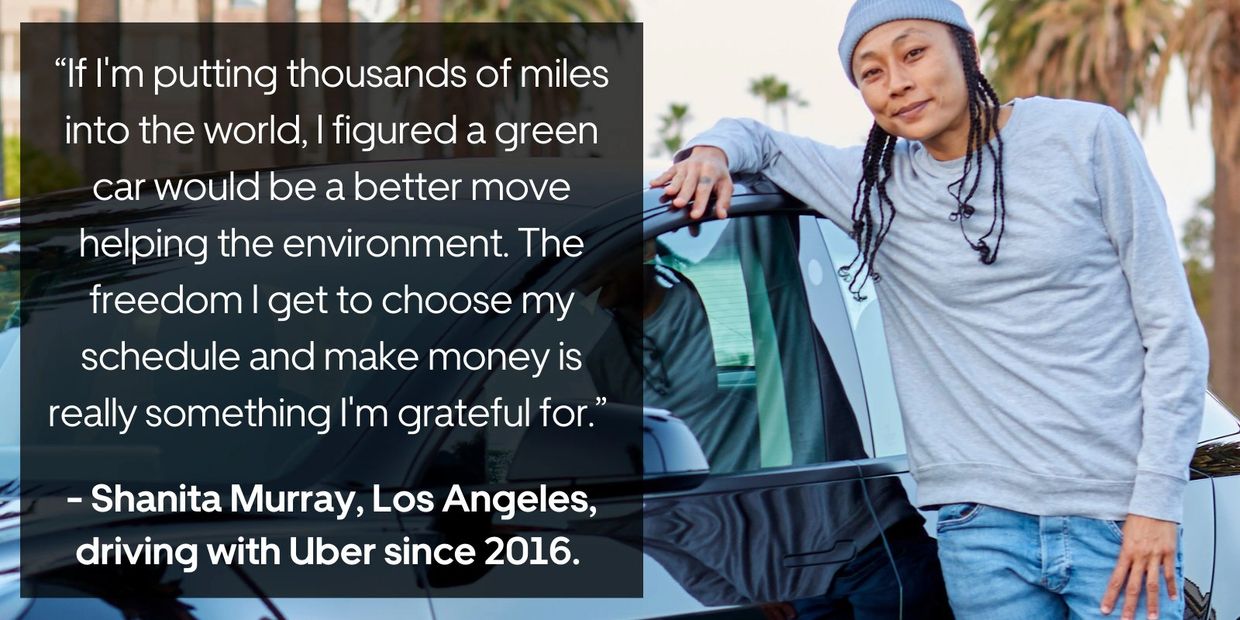 A person leans on a car with an environmental and work freedom quote.