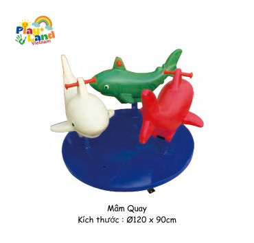 Colorful shark-shaped playground merry-go-round for children.